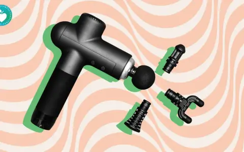 Black massage gun with interchangeable heads, hinting at the massage gun benefits study.