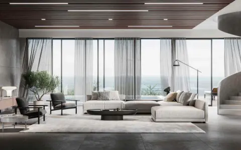Soggiorno moderno con divano componibile, poltrone, tavolino e vista mare. L'arredamento evoca l'eleganza delle case stile americano, con linee pulite e materiali pregiati.
