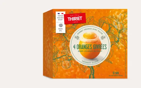 Boîte de sorbet "4 Oranges Givrées" de Maison Thiriet, avec une illustration d'orange garnie de sorbet dans son écorce.