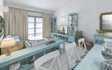 Un soggiorno in stile marinaro con mobili azzurri, cuscini a righe, ancore decorative e un tocco di stile da polo e scarpe da barca.