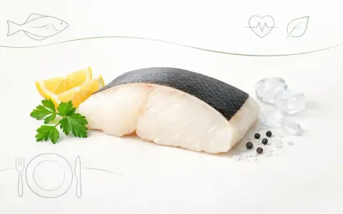 Filet halibuta z cytryną i pietruszką. Niska zawartość halibut kalorie sprawia, że to zdrowy wybór.