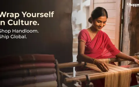 A woman in a red sari weaves on a loom, showcasing the rich tradition of handlooms of India. Stacked fabrics are visible.