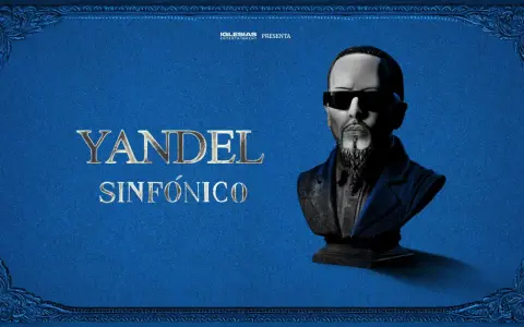 Yandel Sinfónico, un busto del artista con gafas oscuras y barba, sobre un fondo azul texturizado con adornos dorados. Iglesias Entertainment presenta.