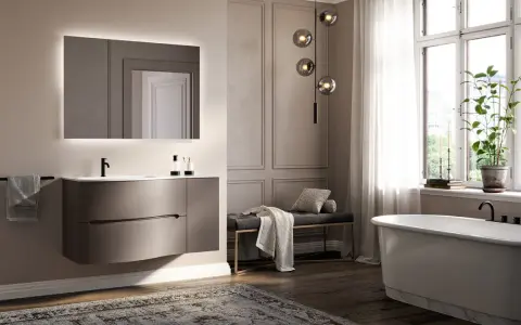 Elegancka łazienka z podwieszaną szafką, wanną i oświetleniem. Świetny pomysł na łazienkę w nowoczesnym stylu.