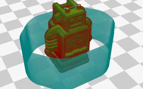 Model robota na drukarce 3D, otoczony niebieską obwódką. To pokazuje, co to adhezja, czyli przyczepność wydruku do stołu.