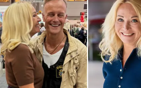 Martina Haag och hennes partner ler glatt. Han bär en väst med polisbricka.