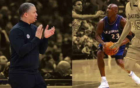 Trener Tyronn Lue klaszcze, podczas gdy Michael Jordan w barwach Wizards z piłką, obok gracza Lakers.