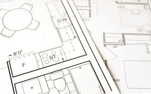 Plany architektoniczne pokazują, jak obliczyć metry kwadratowe pokoju, z zaznaczonymi wymiarami i elementami wyposażenia.