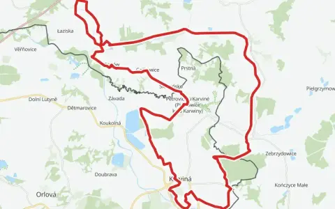 Mapa z zaznaczonym czerwonym szlakiem rowerowym, prowadzącym przez tereny z nazwami miejscowości jak Karviná, Jastrzębie-Zdrój. Idealne miejsce na **żelazny szlak rowerowy parking**.