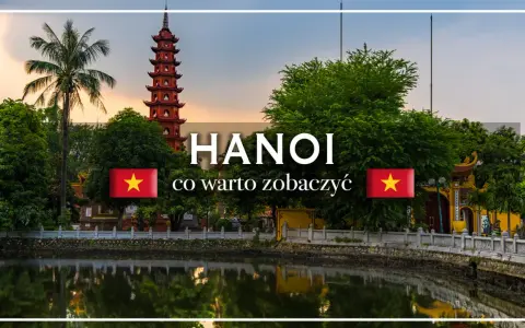 Pagoda w Hanoi nad jeziorem, z palmą i flagą Wietnamu.