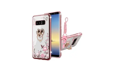Ett transparent Samsung Galaxy Note 8 skal med rosa blommor, fjärilar och en hjärtformad ring med strass. Inkluderar en rosa handledsrem.