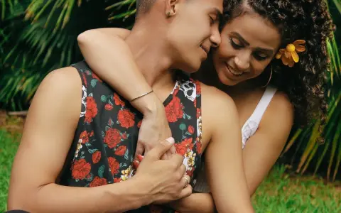 A couple embraces, their faces close, a tender moment that hints at the powerful pull of lust.