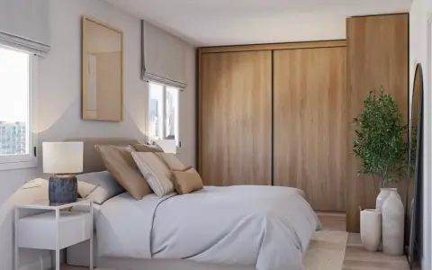 Acogedor dormitorio estilo escandinavo con cama, mesita de noche, armario de madera y planta decorativa.