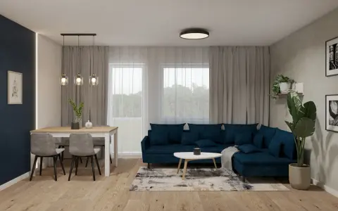 Nowoczesny salon z granatową kanapą i stołem. Dwie lampy wiszące nad stołem i jedna sufitowa tworzą przytulną atmosferę.