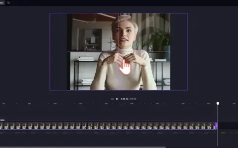 Kobieta w białym golfie, siedząca i mówiąca, z dłonią wskazującą na ekran edytora wideo.