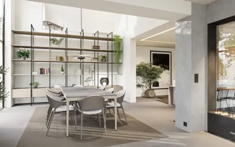 Une salle à manger moderne et lumineuse, avec une grande étagère murale, une table et des chaises, et une cheminée design. Cette **petite extension de maison** est un espace de vie accueillant.