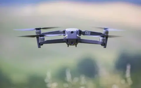 A drone hovers mid-air, its propellers blurred with motion. Planning to fly one in the Dominican Republic? Be sure to check the Dominican Republic drone laws first.