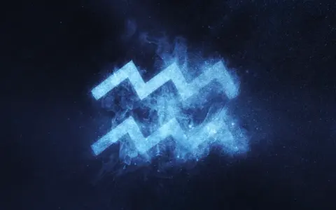 Błękitny symbol Wodnika, znaku zodiaku 6 lutego, lśni na tle nocnego nieba pełnego gwiazd.