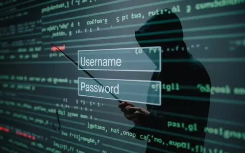 Sylwetka hakera w kapturze celuje wędką z haczykiem w pola logowania "Username" i "Password", symbolizując atak socjotechniczny.