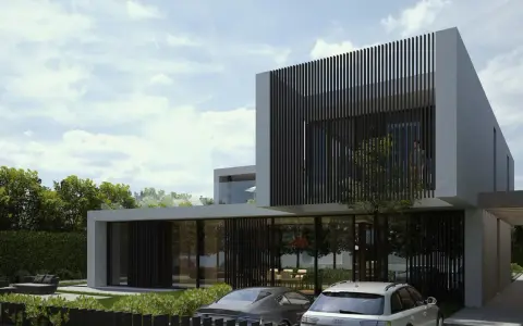 Moderne Villa in Karaj, Iran, mit zwei Autos davor und üppiger grüner Umgebung.