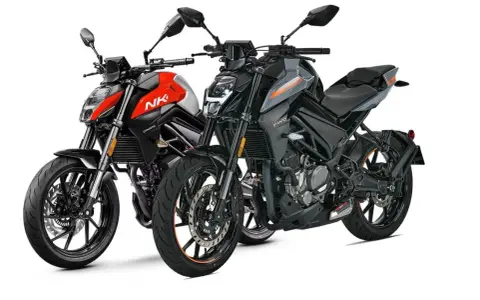 Due moto sportive, una rossa e nera con scritta "NK", l'altra grigia e nera, pronte per la strada.