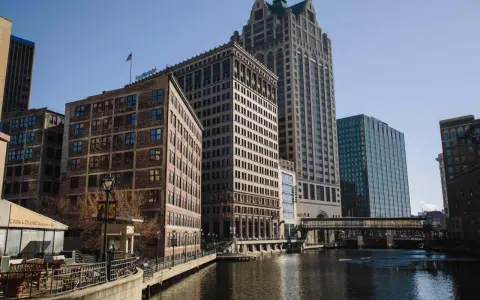 A scenic view of Milwaukee's riverfront buildings, perfect for a weekend getaway.