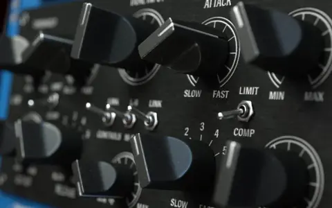 Gros plan sur les boutons et interrupteurs d'un compresseur audio. Réglages d'attaque, de seuil et de ratio sur cet équipement de studio.
