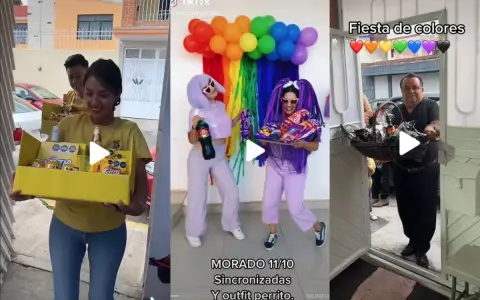 Una fiesta temática de colores vibrantes con globos arcoíris y atuendos morados. Un hombre entrega una canasta de regalos.