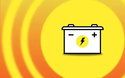 A car battery icon on a yellow background with orange rings. Does disconnecting battery clear codes?