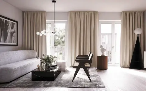 Ett modernt vardagsrum med en elegant soffa, mörkt marmorbord och en unik golvlampa. Blå inredning i vardagsrummet skapar en lugn atmosfär.