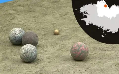 Terrain de jeu pour la boule bretonne, avec des boules de différentes matières et couleurs. Une carte de la Bretagne est visible en arrière-plan.