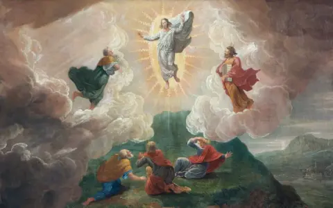 Jesus transfigures in glory, surrounded by Moses and Elijah, as disciples witness the divine event on the feast of the Transfiguration of the Lord.