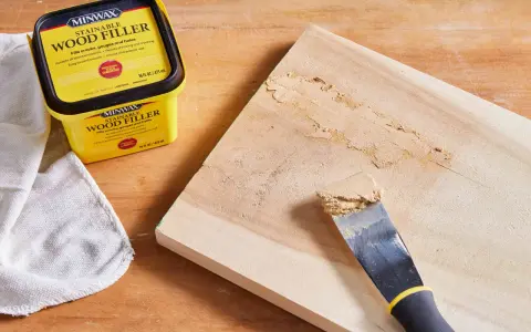 Learn how to use wood filler to repair cracks and gouges on wood. A Minwax container and putty knife are shown.