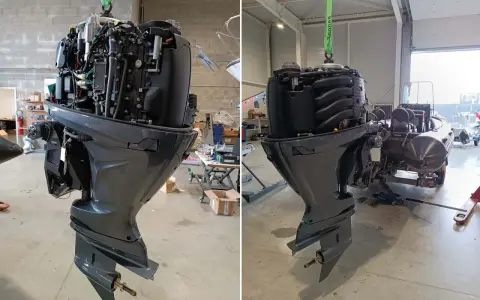 Moteur de bateau suspendu pour révision. Le bloc moteur complexe est visible, prêt pour une maintenance approfondie.