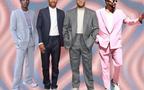 Four men in stylish suits with sneakers. A$AP Rocky in a light blue suit, Frank Ocean in a dark suit, Seth Rogen in a grey suit, and Bad Bunny in a pink suit.