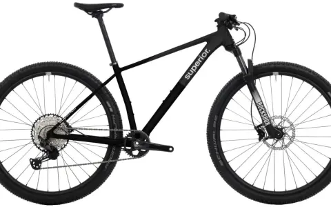 Sleek black mountain bike with "Superior." branding, ready for any road or trail. Features RockShox fork and Schwalbe tires.
