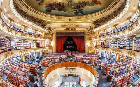 El Ateneo Grand Splendid, a former theatre, is a stunning bookstore in Buenos Aires, showcasing its opulent architecture and vast book collection.