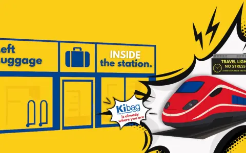 Left luggage sign inside a station with a red train and "Travel Light No Stress" sign.