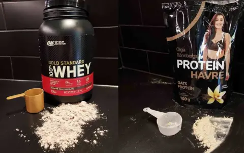 Jämförelse av whey 100 vs 80. En burk Optimum Nutrition Gold Standard 100% Whey och en påse Olga Rönnbergs Protein Havre.