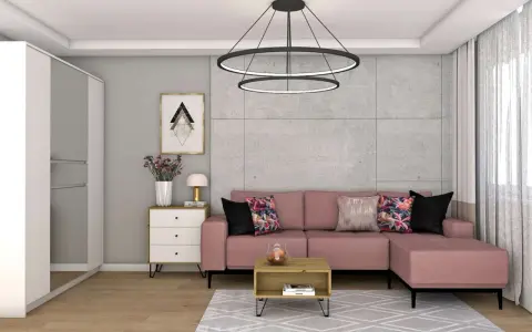 Różowa kanapa i kolorowe poduszki ocieplają szary salon. Wazon z kwiatami i stylowa lampka dodają przytulności.