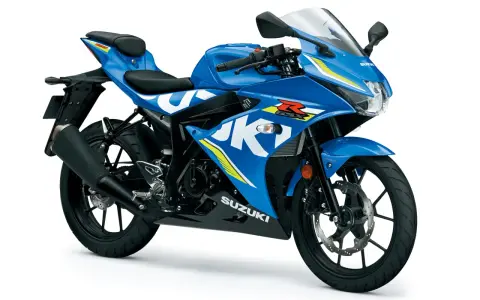 Niebieski motocykl sportowy Suzuki GSX-R 125 z białymi i żółtymi akcentami, gotowy na podbój dróg.