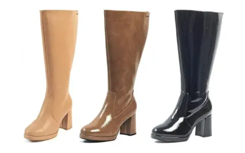 Tres botas altas de tacón, una beige de cuero, otra marrón brillante y una negra charol. La caña de una bota es la parte que cubre la pierna.