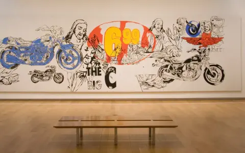 Andy Warhol's "The Last Supper" reimagined with motorcycles and bold graphics, a vibrant commentary on faith and consumerism.