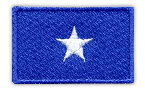 Naszywka z niebieskim tłem i białym, pięcioramiennym gwiazdorem. Symbolizuje flagę Somalii.