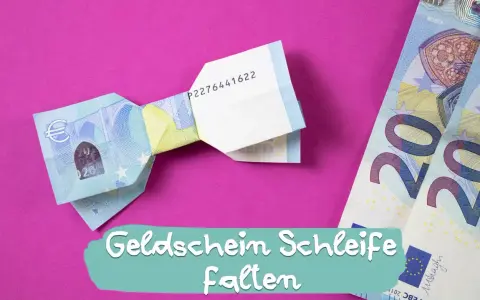 Eine Fliege aus Geld falten ist eine kreative Idee für Geschenke. Hier siehst du eine gefaltete Geld-Fliege auf pinkem Hintergrund.