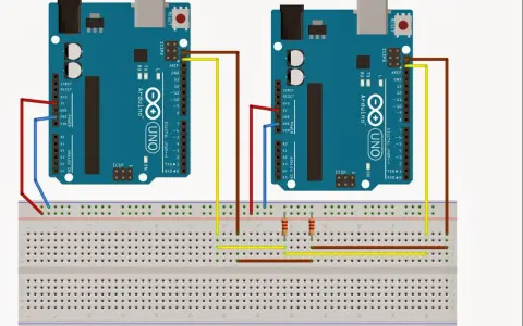 Due Arduino Uno collegati tramite i2c: uno master e uno slave, con fili rossi, gialli e marroni su breadboard.