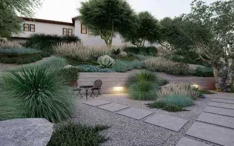 Giardino moderno con ghiaia, piante ornamentali e un piccolo tavolo. Idee giardino con ghiaia per un'oasi di pace.