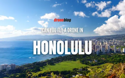 Aerial view of Honolulu, Hawaii, with text asking "Can you fly a drone in Honolulu?" Discussing Hawaii drone laws.