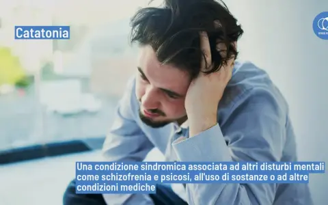Uomo con mano tra i capelli, con la scritta "Catatonia". Il significato di catatonia è una sindrome legata a disturbi mentali.