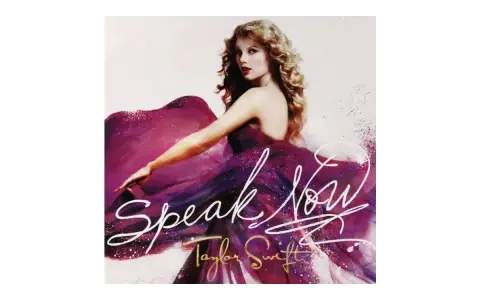 Taylor Swift w fioletowej sukni, z napisem "Speak Now".